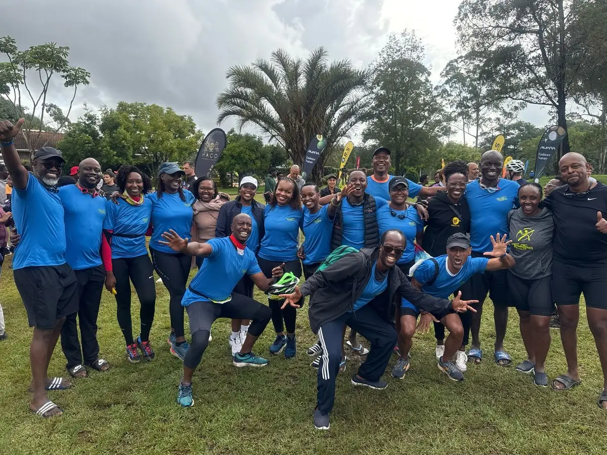 TipwaTipwa members in club shirts leaping for a group photo